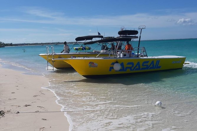Capt Marvin Watersports / Parasail - Public Tour - Taking off from Grace Bay Beach