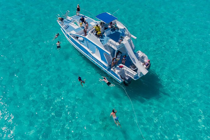 Private 7-Hour Catamaran Tour in Turks and Caicos - Food, drinks, music, and the second deck